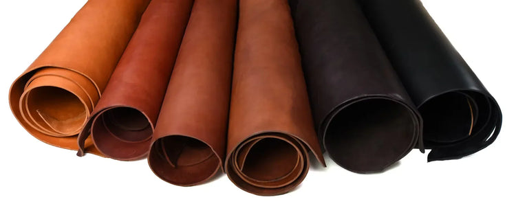 Six rolls of bridle leather in tan, chestnut, brown and black